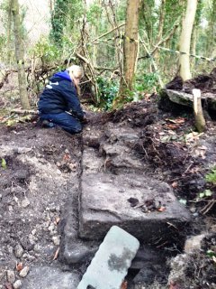 Rachel uncovering Mechanics Workshop wall